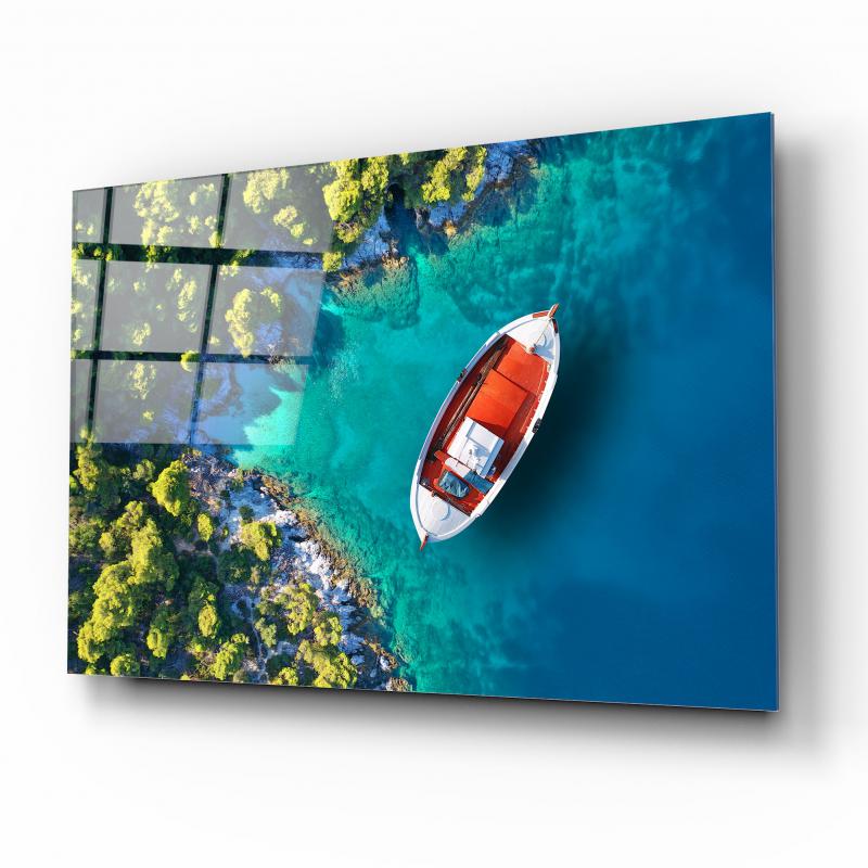 Tableau mural en verre représentant un bateau sur la plage