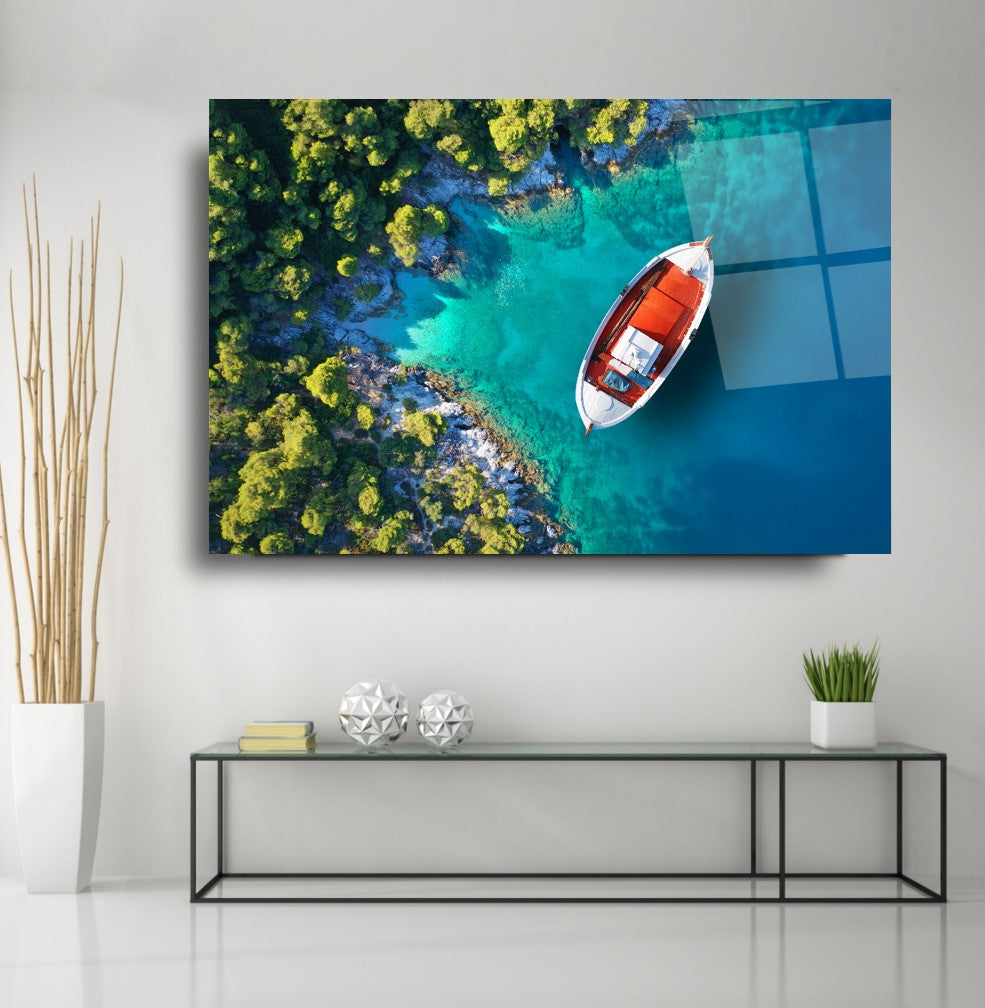 Tableau mural en verre représentant un bateau sur la plage