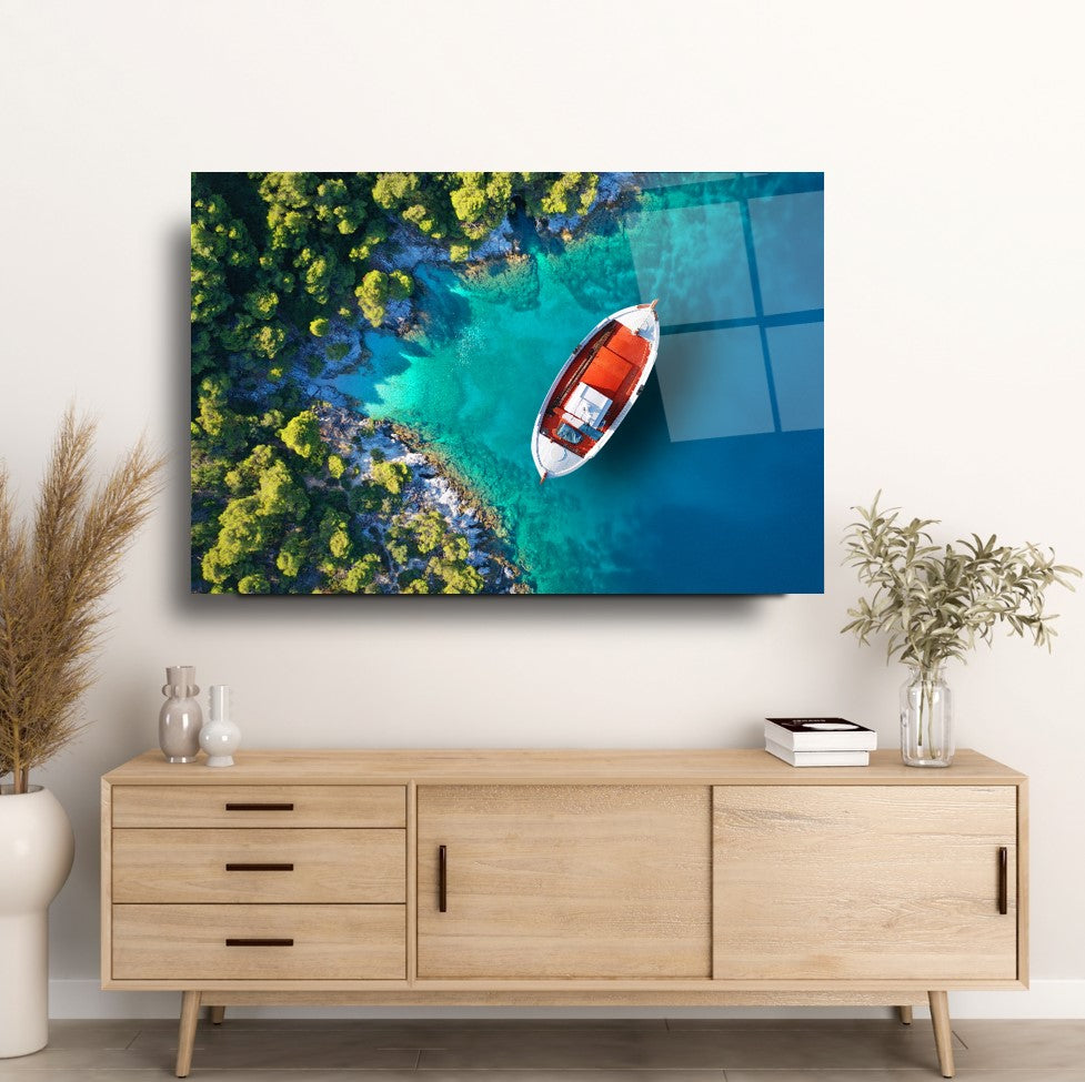 Tableau mural en verre représentant un bateau sur la plage