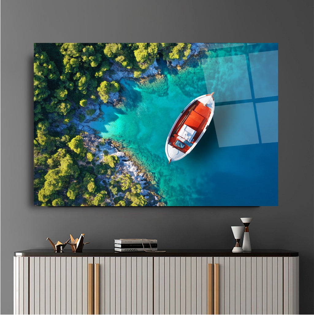 Tableau mural en verre représentant un bateau sur la plage