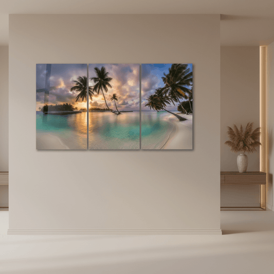 Tropical beach sunset triptych glass wall art in a luxury entrance hall with sand beige walls and a pampas grass vase on the console