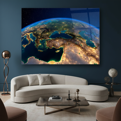 Earth at night glass wall art displayed in a contemporary living room