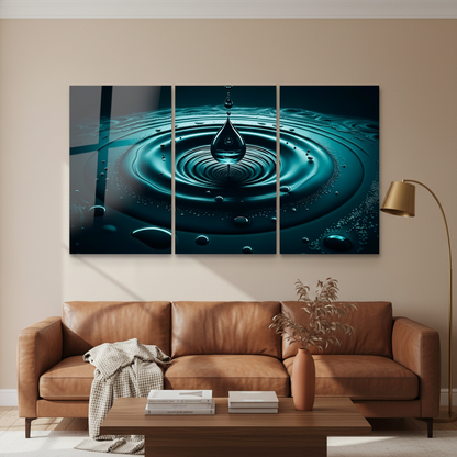 Teal water drop triptych glass wall art in a living room with cognac leather sofa and warm beige walls