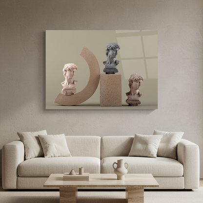 Classical Busts Glass Wall Art above a cream sofa in a soft minimalist living room