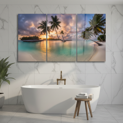 Tropical beach sunset triptych glass wall art in a luxury bathroom with white marble walls and a freestanding bathtub
